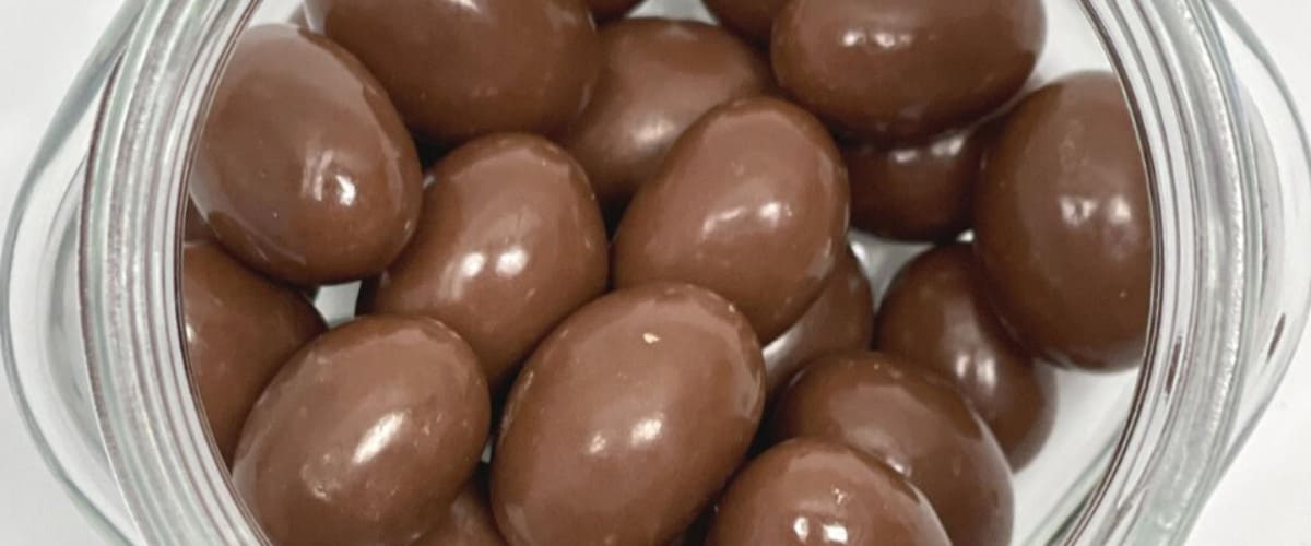 Fotografía de frutos secos Prunita con chocolate. Frutos secos con chocolate - Pasas con chocolate - Pistachos - arandanos - almendras - Prunita - Quiero Delicatessen - Villena - Alicante